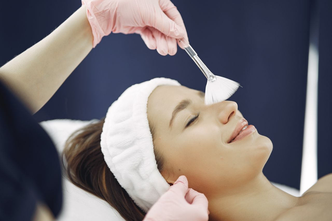 Crafting Captivating Headlines: Your awesome post title goes here Woman enjoying a relaxing facial treatment at a spa, highlighting skincare and relaxation.